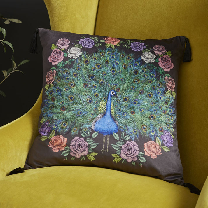 Elevate your space with a touch of enchantment, courtesy of this stylish peacock cushion. Featuring a majestic peacock roaming in a stately home garden in the English countryside creating a striking and vibrant piece for your home.