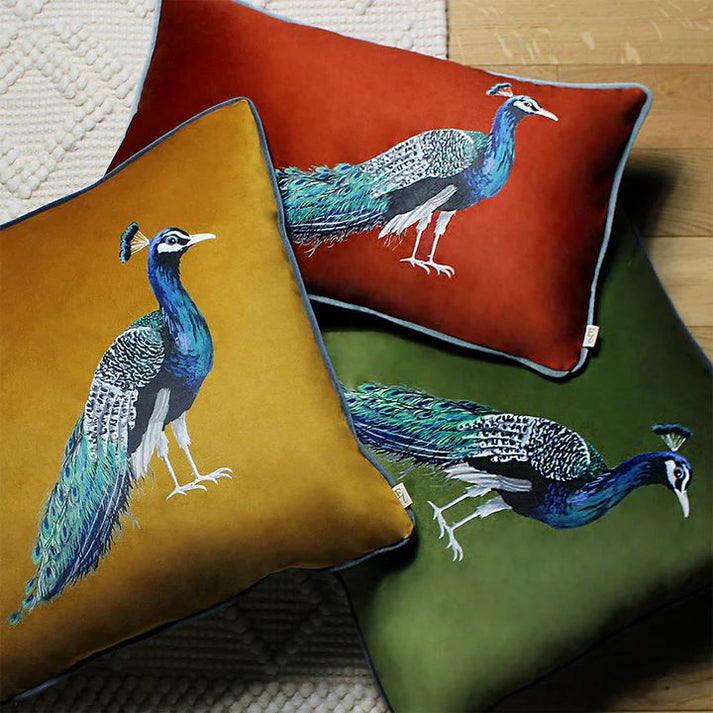 This proud peacock will make a charming cushion for your room, adding a touch of timeless style. With its feather filling and soft velvet finish in a warm sunset orange it is a truly unique piece!