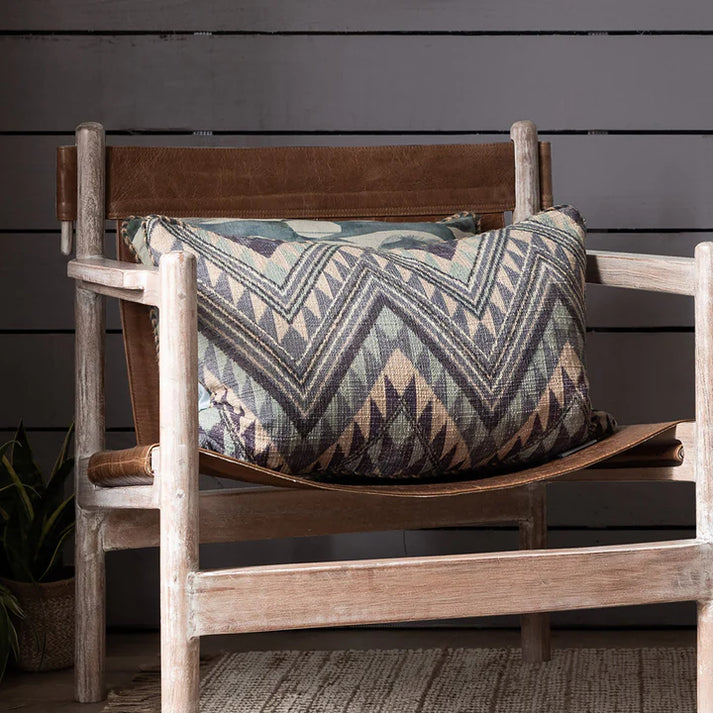 This Sandova cushion features a bold Aztec-inspired pattern that adds visual intrigue to any room. Filled with high-quality down feathers, it provides exceptional support and luxurious comfort.