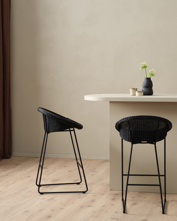 The Joe counter stool with it is sleek sled base is loved by many because of its versatile design. The delicately woven seat adds a warm touch to any interior while the steel base gives the stool a more contemporary look.