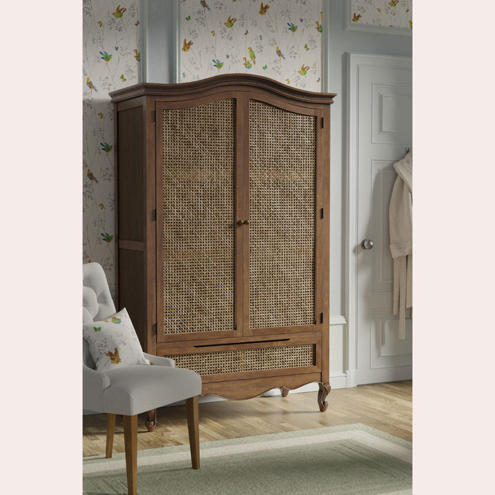 This elegant wardrobe will make a stunning centre piece for any bedroom. It is skilfully crafted using both solid and veneered panels with a rich aged walnut finish. Inspired by classic French styling, with cabriole legs, gracefully curved lines, and charming rattan fronted doors. Inside, there is a hanging rail and a smooth metal runner mounted drawer, adding even more storage space.