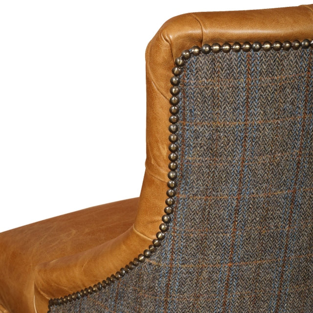 Stylish bar chair featuring a leather seat with a Harris Tweed contrasting back. Suited to a breakfast bar or a bar table this stool will make a subtle statement to your space.